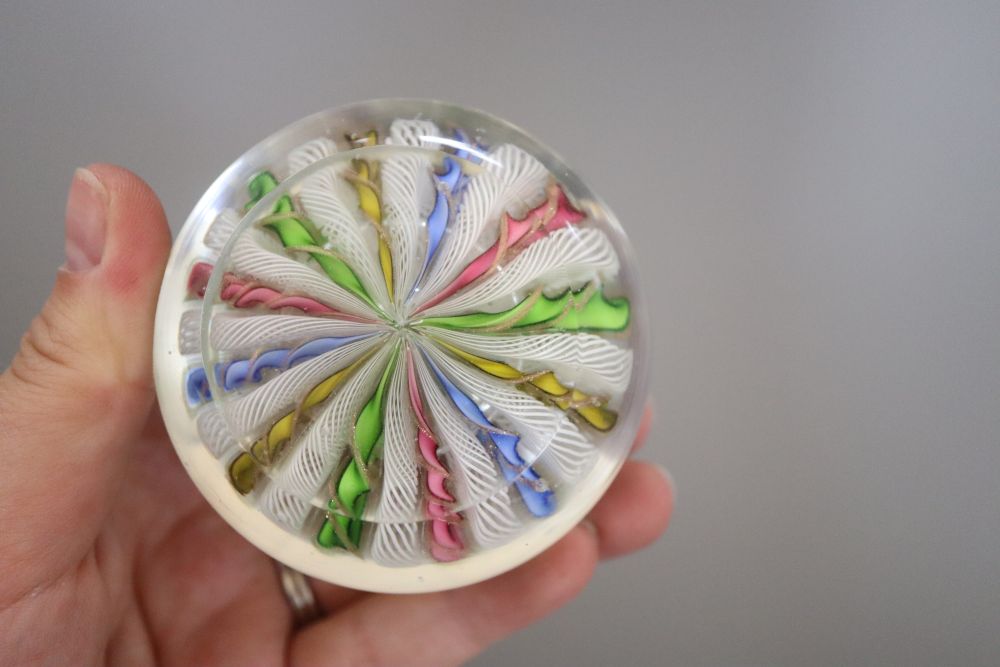 A millefiore paperweight and another paperweight